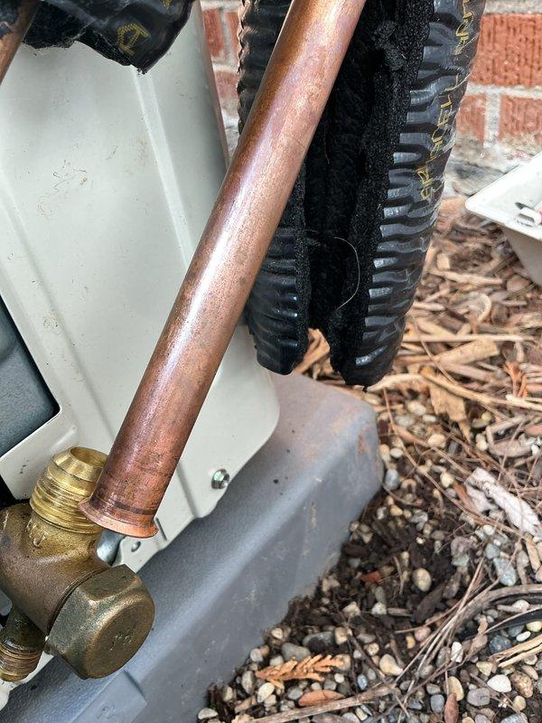 Responded to no-cooling complaint on 3-year-old minisplit system in main room. Upon inspection, identified defective flare connection on suction line causing refrigerant leak and loss of cooling capacity. System requires return visit with refrigerant flaring tool to properly repair suction side flare connection. Work covered under warranty.