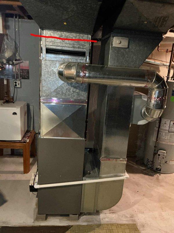 Completed HVAC system evaluation for replacement estimate on residential property with 30+ year old equipment utilizing R22 refrigerant. Inspected basement-located air handler unit, existing ductwork configuration, and current thermostat controls to assess system condition and provide comprehensive replacement options for aging cooling system.