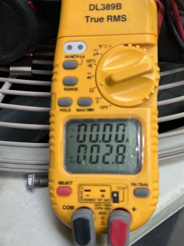 Responded to no cooling complaint on 10-year-old exterior AC unit. Upon arrival, performed diagnostic testing using digital multimeter to check electrical components and system functionality. Measured voltage and amperage readings at multiple test points to identify system failure. Testing revealed electrical issue preventing proper operation. Completed comprehensive troubleshooting of outdoor condensing unit, checking capacitor, contactor, and compressor circuits. Documented findings with diagnostic equipment readings showing system status at 27.92 on meter display during testing phase. Unit required electrical component evaluation to restore cooling functionality.