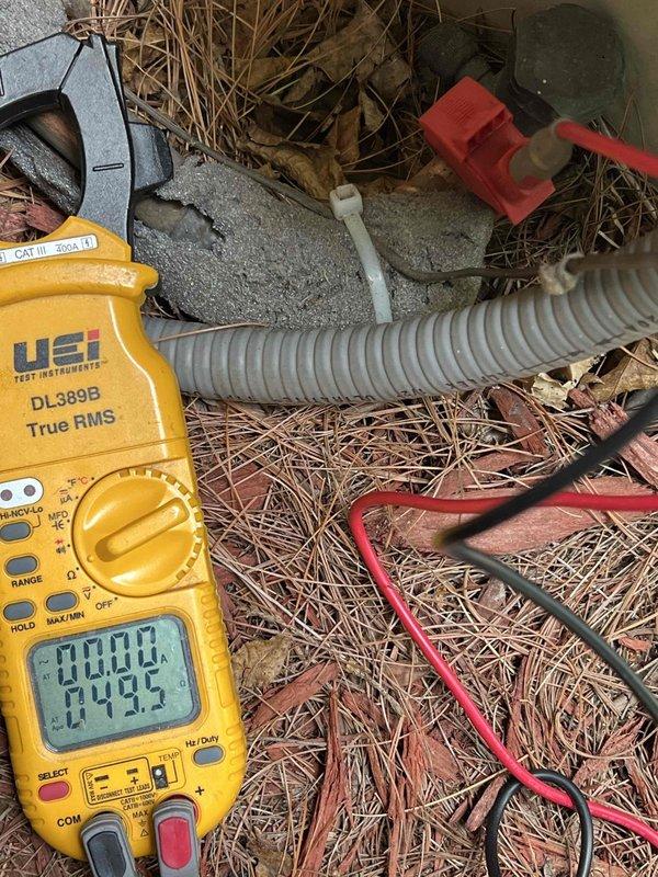 Responded to no cooling complaint on 10-year-old exterior AC unit. Upon arrival, performed diagnostic testing using digital multimeter to check electrical components and system functionality. Measured voltage and amperage readings at multiple test points to identify system failure. Testing revealed electrical issue preventing proper operation. Completed comprehensive troubleshooting of outdoor condensing unit, checking capacitor, contactor, and compressor circuits. Documented findings with diagnostic equipment readings showing system status at 27.92 on meter display during testing phase. Unit required electrical component evaluation to restore cooling functionality.