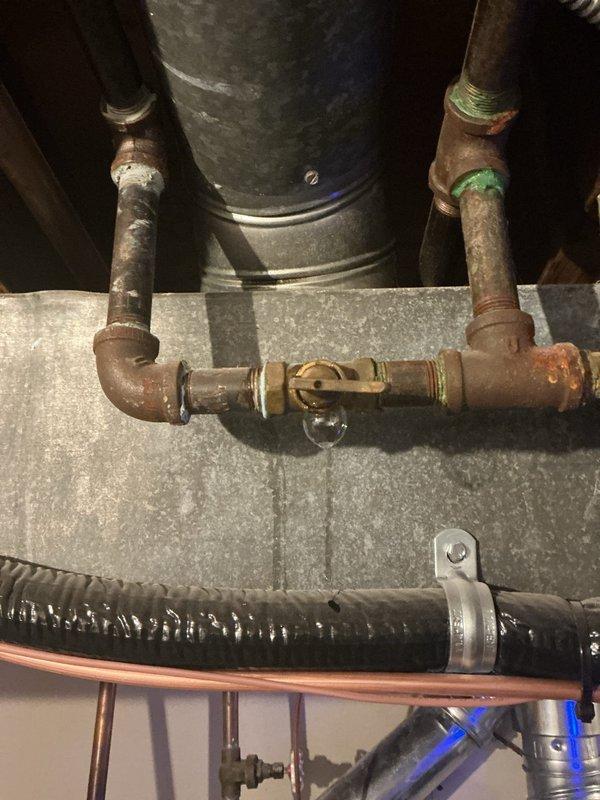 Responded to report of gas odor near furnace in basement. Upon arrival, performed thorough visual inspection of one-month-old heating/cooling system and surrounding gas piping infrastructure. Conducted comprehensive gas leak detection testing on all gas line connections, joints, and fittings associated with furnace installation. Inspected gas valve, supply lines, and union connections for potential leak sources. Utilized combustible gas detector to verify presence and location of any gas leaks throughout mechanical room area.

Examination revealed corroded copper water piping in vicinity of HVAC equipment, showing significant oxidation and green patina buildup on joints and fittings. While water piping corrosion was noted, primary focus remained on gas system integrity. Inspected all accessible gas piping connections, threaded joints, and valve assemblies. Verified proper installation of gas supply line to furnace, checking for loose fittings or improper sealing.

Testing confirmed no 