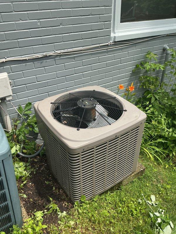 Completed comprehensive Gold AC Inspection on two outdoor air conditioning condenser units located at the property exterior. Performed thorough maintenance on both systems including inspection of condenser coils, fan motors, electrical connections, and refrigerant levels. Both units showed signs of age with weathered cabinets but were found to be in operational condition. Cleaned condenser coils on both units, verified proper airflow through louvers, tested capacitors and contactors, and ensured adequate clearance from surrounding vegetation. Checked electrical meter connections and verified proper voltage supply to both condensers. Inspected fan blades and motor assemblies for wear, lubricated moving components as needed, and confirmed proper fan operation on both units. All safety controls tested and functioning within normal parameters. Recommended ongoing seasonal maintenance to ensure continued reliable operation throughout cooling season.