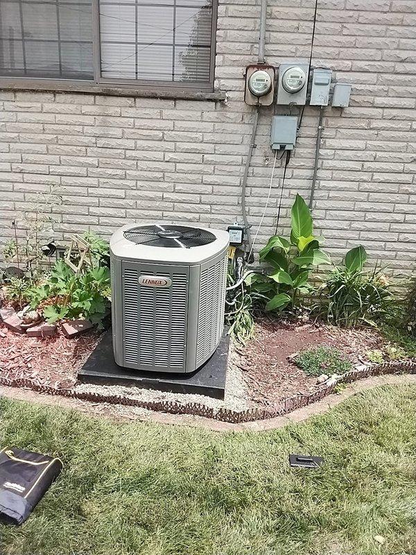 Completed installation of 2.5-ton Lennox air conditioning system with matching evaporator coil at residential property. Unit was positioned on pad at rear of building with proper electrical disconnect and reconnection to existing service panel. System was charged with refrigerant, pressures and temperatures verified within manufacturer specifications using digital manifold gauges, and unit tested for proper operation. Mechanical, electrical, and air conditioning permits requested for compliance.