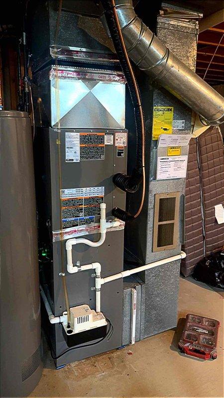Successfully completed installation of 2.5 ton air conditioning system with evaporator coil in basement utility area. Installed new A/C unit with rear discharge configuration, mounted evaporator coil to existing furnace, and connected refrigerant lines with proper insulation. Established condensate drainage system with PVC piping and condensate pump, verified all electrical connections, and reconnected system components to ensure proper operation. Mechanical, electrical, and air conditioning permits were obtained prior to installation. System tested and operational upon completion.
