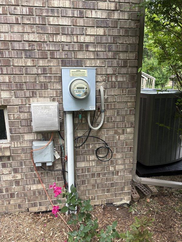 Completed full HVAC system installation including 90,000 BTU high-efficiency furnace and 4-ton air conditioning unit in rear yard location. Installed humidifier, reconnected existing ductwork, and mounted smart thermostat with digital display. Secured mechanical and electrical permits, verified AHRI certification number 216723007, and confirmed system qualifies for utility rebates.