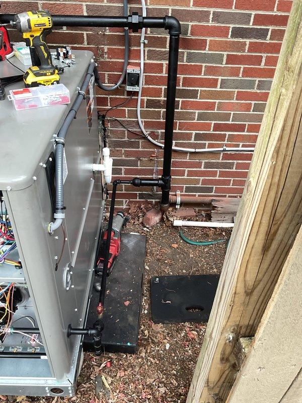 Completed full packaged HVAC system installation with all mechanical, electrical, and reconnection work. Coordinated fence removal for equipment access and installed unit on exterior pad with proper electrical disconnect, control panel mounting, and refrigerant line routing along brick wall. Obtained necessary mechanical and electrical permits, completed all required connections including condensate drainage, and verified system operation upon startup.