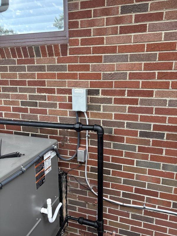 Completed full packaged HVAC system installation with all mechanical, electrical, and reconnection work. Coordinated fence removal for equipment access and installed unit on exterior pad with proper electrical disconnect, control panel mounting, and refrigerant line routing along brick wall. Obtained necessary mechanical and electrical permits, completed all required connections including condensate drainage, and verified system operation upon startup.