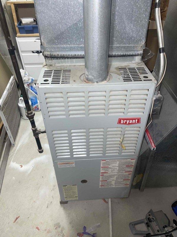 Completed HVAC system estimate for furnace replacement at property currently equipped with boiler and air conditioning system. Verified existing ductwork infrastructure and proper venting configuration to ensure compatibility with proposed Bryant furnace installation. Documented current basement-mounted furnace unit with insulated supply ductwork and existing digital thermostat control system. Assessed utility room layout, clearances, and mechanical requirements for seamless equipment replacement while maintaining proper airflow distribution throughout the residence.