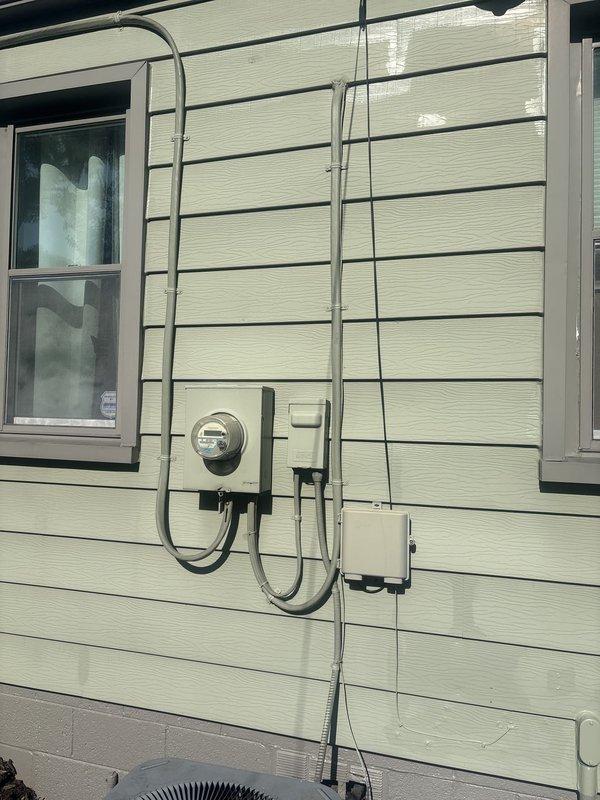 Conducted site assessment and provided estimate for conversion of overhead electrical service to underground installation. Evaluated existing meter base, service entrance conductors, and conduit routing on exterior wall. Documented current electrical configuration including disconnect locations and conduit pathways to determine scope of work required for underground service transition.