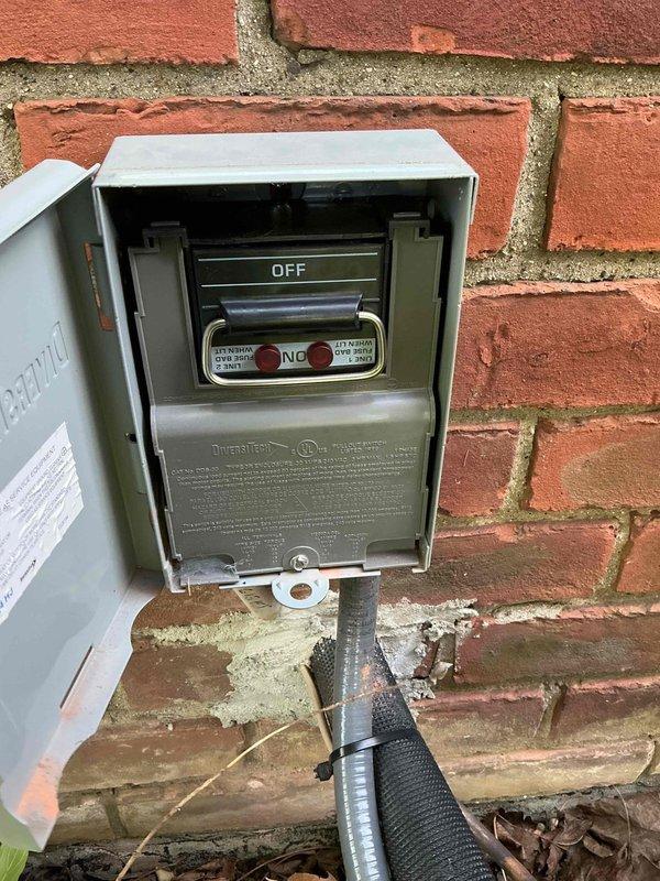 Responded to no-start condition on 8-month-old Lennox cooling system with basement-located air handler and exterior condenser unit. Upon arrival, inspected electrical disconnect panel at outdoor unit and verified proper operation of condenser. System evaluated under existing purchase order for TXV-related work. Confirmed unit operational status, documented equipment condition with photographs showing proper installation against brick exterior wall with adequate clearance and landscaping. All components functioning as designed at time of inspection.