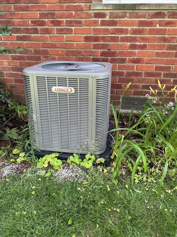 Responded to no-start condition on 8-month-old Lennox cooling system with basement-located air handler and exterior condenser unit. Upon arrival, inspected electrical disconnect panel at outdoor unit and verified proper operation of condenser. System evaluated under existing purchase order for TXV-related work. Confirmed unit operational status, documented equipment condition with photographs showing proper installation against brick exterior wall with adequate clearance and landscaping. All components functioning as designed at time of inspection.