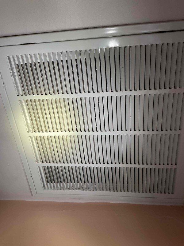 Responded to service call for condensate leak on one-week-old AC unit located in attic. Upon inspection, identified restricted airflow due to missing or improperly installed air filter at return vent, causing evaporator coil to freeze and subsequent water overflow from drain pan. Installed new Filtrete 20x20x1 air filter at return grille and verified proper system airflow and drainage operation before clearing the call.