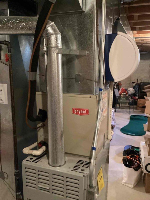 Conducted on-site evaluation of 24-year-old Bryant furnace located in basement and exterior air conditioning unit for replacement estimate. Documented existing equipment configuration, including furnace installation with metal exhaust venting system, electrical connections, and ductwork layout. Assessed mechanical room space requirements and clearances for new equipment installation, photographed current system setup to determine proper sizing and compatibility requirements for replacement units.