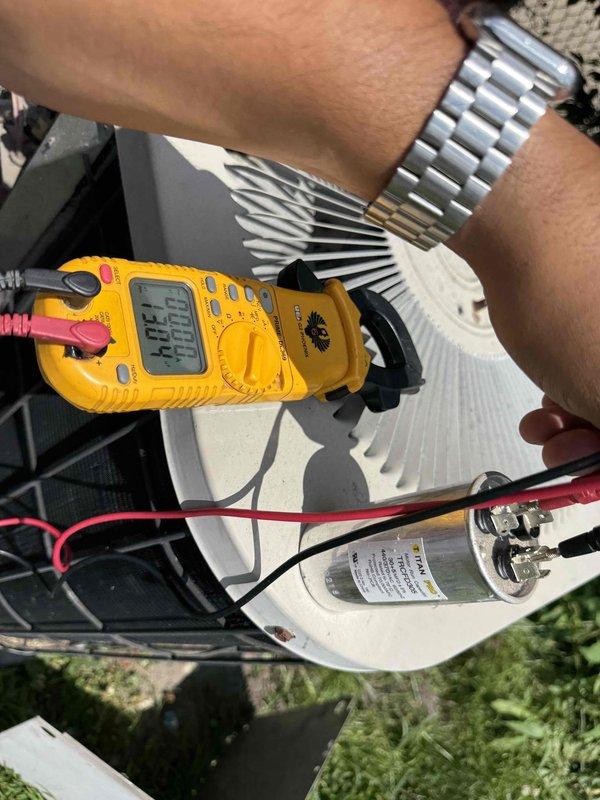 Responded to no-cool call on 10+ year old AC unit with reported abnormal noise and non-operational fan. Upon arrival, performed diagnostic testing on outdoor condenser unit using digital multimeter to check capacitor functionality and electrical components. Testing revealed failed capacitor preventing compressor and condenser fan motor operation. Replaced defective dual-run capacitor, verified proper voltage and amperage readings, and confirmed system returned to normal operation with condenser fan running smoothly and compressor cycling properly. Unit tested successfully and restored to full cooling capacity.