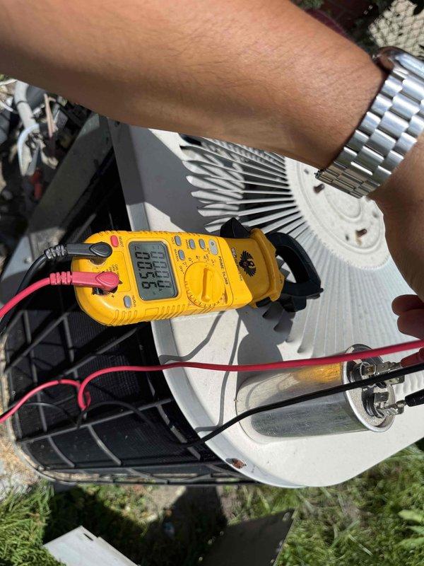 Responded to no-cool call on 10+ year old AC unit with reported abnormal noise and non-operational fan. Upon arrival, performed diagnostic testing on outdoor condenser unit using digital multimeter to check capacitor functionality and electrical components. Testing revealed failed capacitor preventing compressor and condenser fan motor operation. Replaced defective dual-run capacitor, verified proper voltage and amperage readings, and confirmed system returned to normal operation with condenser fan running smoothly and compressor cycling properly. Unit tested successfully and restored to full cooling capacity.