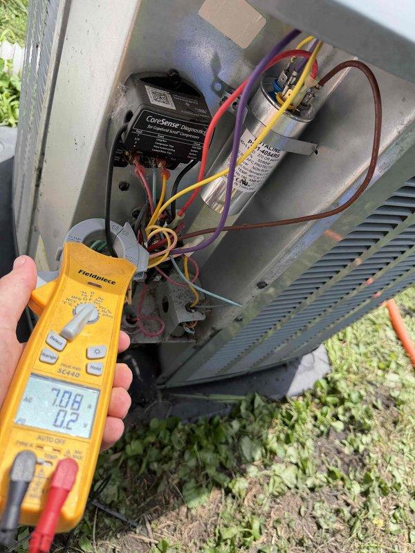 Responded to no cooling complaint on 7-year-old residential air conditioning system. Upon arrival, found outdoor condensing unit inoperative. Performed diagnostic testing and identified failed dual run capacitor preventing compressor and condenser fan motor operation. Verified capacitor failure using digital multimeter, reading zero microfarads on affected terminals. Replaced defective Aqualine FB291-405RU2 capacitor with new OEM-equivalent component rated at 370/440VAC. Restored power to unit and confirmed proper compressor startup, condenser fan operation, and normal system pressures. Tested system through complete cooling cycle with all components functioning within manufacturer specifications. System returned to full operational status with proper cooling restored.