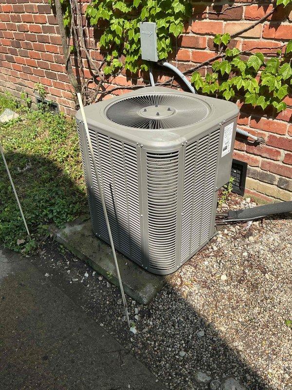Responded to no-cooling complaint on central air conditioning system. Upon arrival, confirmed thermostat calling for cooling with indoor blower operational and outdoor condenser fan running, but compressor humming without starting. Suction line not cold and supply air only mildly cool, indicating no refrigerant circulation. Diagnosed failed compressor start capacitor preventing compressor from initiating proper run cycle. Replaced defective capacitor with OEM specification component. Tested system operation and confirmed compressor started successfully with proper amp draw. Verified suction line temperature dropping and supply air cooling adequately. System restored to normal cooling operation with house temperature beginning to decrease as expected.