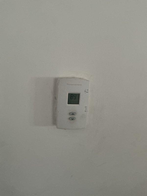 Conducted comprehensive assessment of basement HVAC system for air conditioning replacement estimate. Evaluated existing ductwork configuration, including galvanized steel and flexible ducting sections with multiple transitions and elbow joints showing age-related wear and dust accumulation. Documented current Honeywell thermostat set at 85 degrees and reviewed system layout to determine optimal replacement equipment specifications and installation requirements.