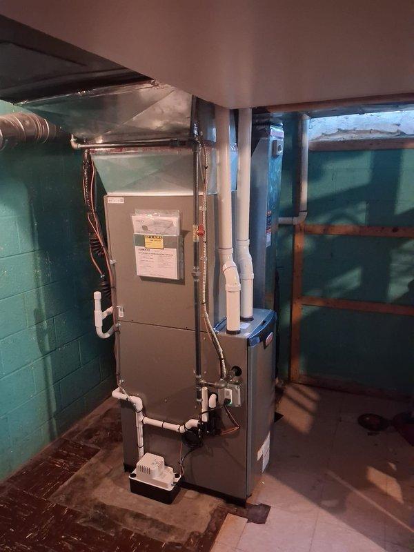 Completed full HVAC system installation including 70,000 BTU furnace rotated 90 degrees for optimal placement in basement mechanical room, 3-ton air conditioning unit positioned in rear yard, Ecobee 3 Lite smart thermostat, humidifier integration, and condensate pump. Secured mechanical and electrical permits, installed all necessary PVC venting and drainage lines with proper routing through ceiling joists, reconnected existing ductwork to new furnace, and established all copper refrigerant lines between outdoor condenser and indoor coil. System tested and verified operational with utility rebate documentation completed for consumer energy programs.
