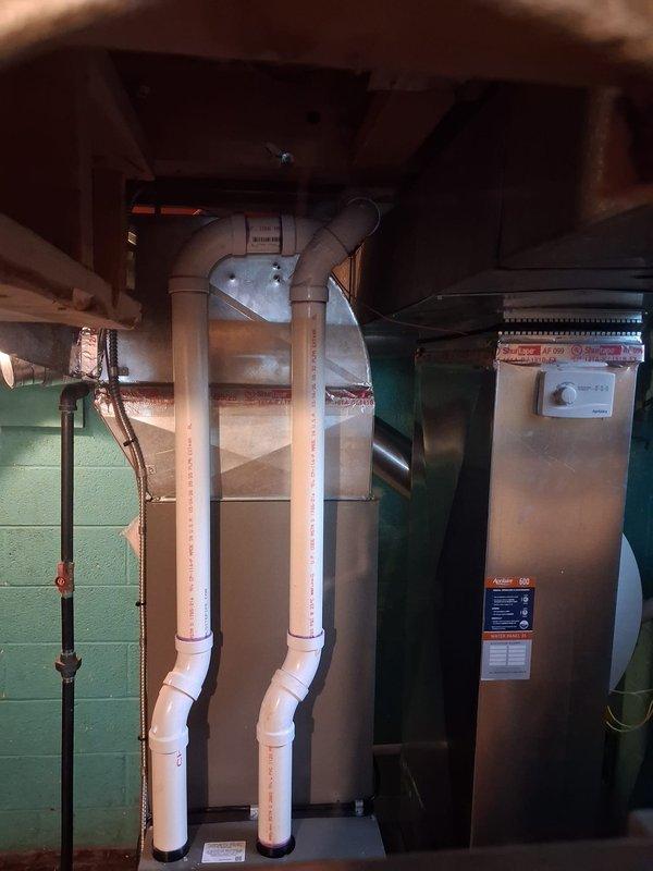 Completed full HVAC system installation including 70,000 BTU furnace rotated 90 degrees for optimal placement in basement mechanical room, 3-ton air conditioning unit positioned in rear yard, Ecobee 3 Lite smart thermostat, humidifier integration, and condensate pump. Secured mechanical and electrical permits, installed all necessary PVC venting and drainage lines with proper routing through ceiling joists, reconnected existing ductwork to new furnace, and established all copper refrigerant lines between outdoor condenser and indoor coil. System tested and verified operational with utility rebate documentation completed for consumer energy programs.