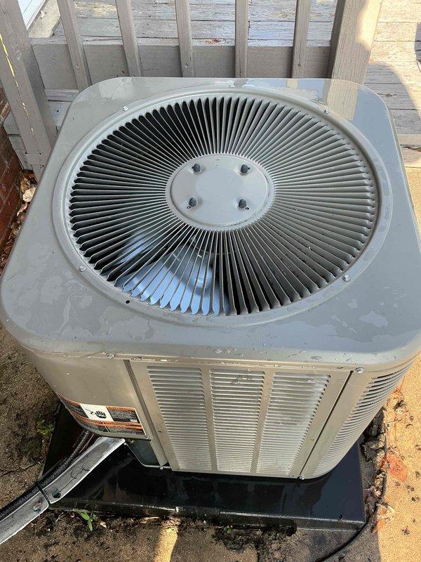 Completed comprehensive cooling maintenance and tune-up on 7-year-old residential air conditioning system. Unit was operational upon arrival and confirmed to be working properly by customer. Performed standard AC tune-up procedures including inspection of outdoor condenser unit, verification of fan operation, and system performance evaluation. Unit exterior shows age-appropriate weathering and rust staining on cabinet panels but remains structurally sound and fully functional. Documented equipment condition with photographs showing condenser mounted on protective pad with proper clearances maintained. All maintenance tasks completed successfully and system left in proper working order.