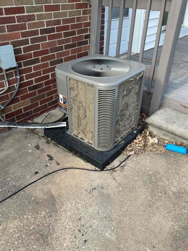 Completed comprehensive cooling maintenance and tune-up on 7-year-old residential air conditioning system. Unit was operational upon arrival and confirmed to be working properly by customer. Performed standard AC tune-up procedures including inspection of outdoor condenser unit, verification of fan operation, and system performance evaluation. Unit exterior shows age-appropriate weathering and rust staining on cabinet panels but remains structurally sound and fully functional. Documented equipment condition with photographs showing condenser mounted on protective pad with proper clearances maintained. All maintenance tasks completed successfully and system left in proper working order.