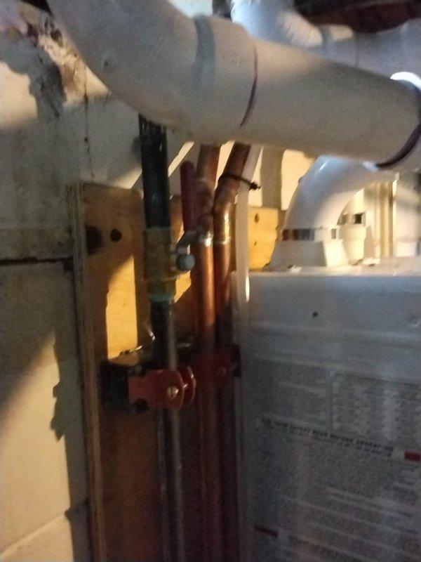 Completed HVAC installation warranty service addressing failed inspection due to improper gas valve installation. Replaced non-compliant gas valve with manufacturer-specified full port gas valve on gas supply line to ensure proper flow capacity and code compliance. Verified all connections, tested system operation, and documented corrected installation with photos showing compliant copper gas piping, proper valve installation, insulated ductwork, and integration with existing HVAC infrastructure in mechanical space.