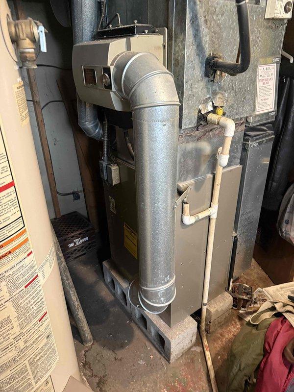 Performed comprehensive second opinion evaluation on non-operational 2003 HVAC system after customer received replacement recommendations from two previous contractors. Conducted thorough diagnostic inspection of furnace and air conditioning components, including visual assessment of air handler, ductwork connections, electrical controls, and mechanical systems. Examined condition of existing equipment installation, ductwork integrity, and overall system infrastructure in basement mechanical room. Documented equipment age, configuration, and current operational status through detailed photographic evidence for customer records and recommendation development.