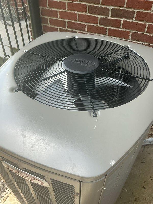 Completed comprehensive Gold AC inspection on two residential HVAC units, both approximately 5 years old. Performed thorough examination of outdoor Lennox condenser unit and secondary system, both mounted on concrete pads against exterior brick wall. Inspected condenser cabinets, top-discharge fan assemblies, protective grilles, and ventilation louvers for proper operation and physical condition. Verified refrigerant line connections, electrical conduit, and associated piping. Checked concrete pad stability and unit levelness. Both systems operating normally with no deficiencies noted. Provided complimentary air filter as part of Gold maintenance package. Equipment shows appropriate wear for age with functional components in good working order.