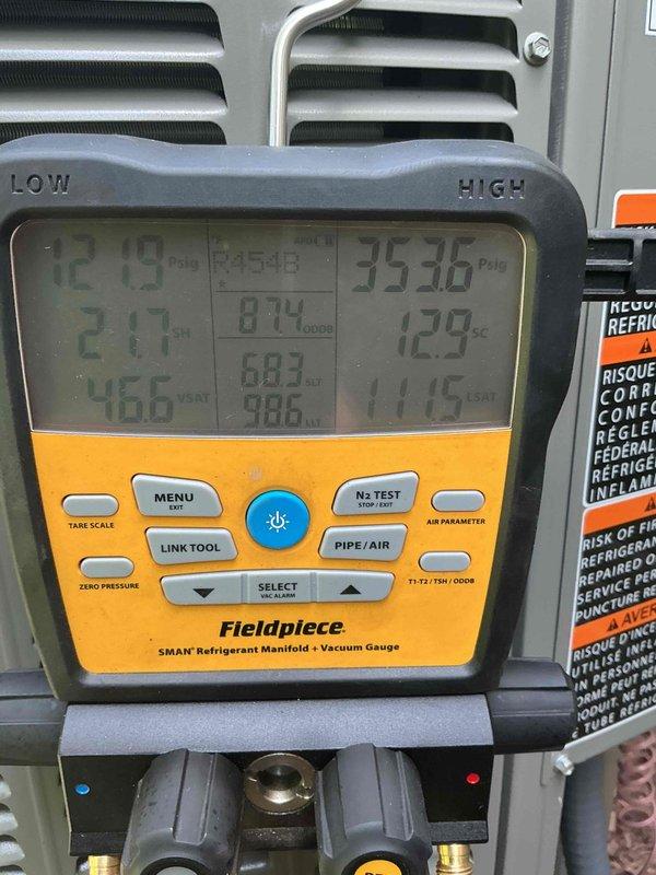 Completed installation of 3.5-ton air conditioning system with evaporator coil at rear of residence. System was properly charged with refrigerant, vacuum tested to manufacturer specifications, and all pressure readings verified within normal operating parameters. Unit positioned on composite pad with proper clearances, electrical disconnect reconnected, and system commissioned with successful startup and operational testing confirmed.