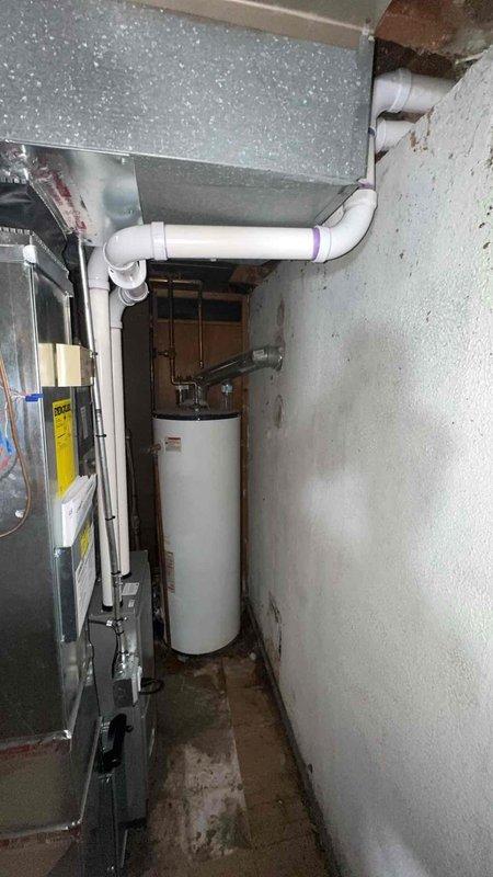 Completed full furnace installation in basement mechanical room, replacing existing heating unit with new 70,000 BTU system. Installation included all necessary mechanical and electrical connections, proper venting, and ductwork integration with existing HVAC infrastructure. System was tested for proper operation, all connections were verified for safety and code compliance, and permits were obtained for mechanical and electrical work. Customer qualified for utility rebate program upon completion of installation.