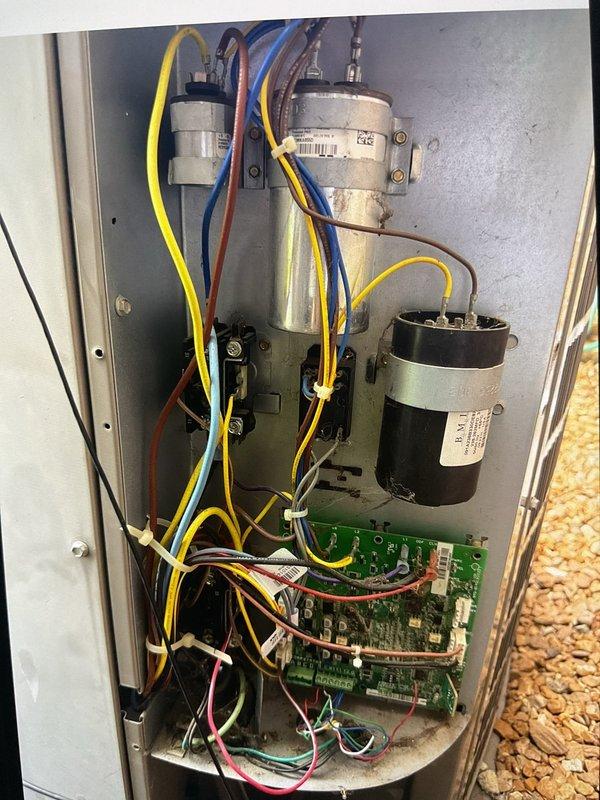 Responded to no cooling complaint with complete system failure affecting both air conditioning and heating control. Upon arrival, found furnace and smart thermostat completely non-functional with no power to either unit. Performed diagnostic troubleshooting on 3-year-old furnace system located in basement. Identified failed TR40R dual element time delay fuse (40A 250V) in outdoor condensing unit disconnect as root cause of system failure. Inspected electrical control panel, capacitors, and circuit board for additional damage or failure points. Removed defective Tri-onic Smart SPOT fuse and replaced with new component, restoring power to system. Verified proper operation of furnace control board, thermostat communication, and air conditioning functionality. Tested all electrical connections and confirmed system restored to full operation. Coordinated with field supervisor per service protocol to review troubleshooting procedures and findings due to recurring service history. System retu