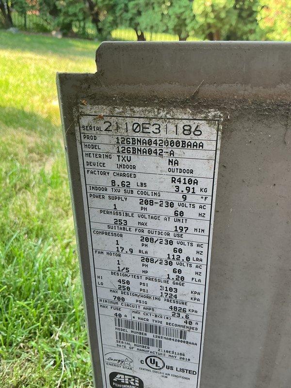 Performed comprehensive tune-up and inspection on a 10+ year old Goodman air conditioning unit (Model: 12GBNA042000BA88, Serial: 2110E31186) located in the basement with outdoor condenser. Inspected condenser unit fan assembly, verified proper operation of top-mounted fan grille and motor, checked manufacturer specifications including R410A refrigerant charge and electrical ratings at 208-230V AC. Evaluated overall system condition, confirmed unit functionality, and documented equipment specifications for maintenance records. System operating within normal parameters upon completion of inspection.