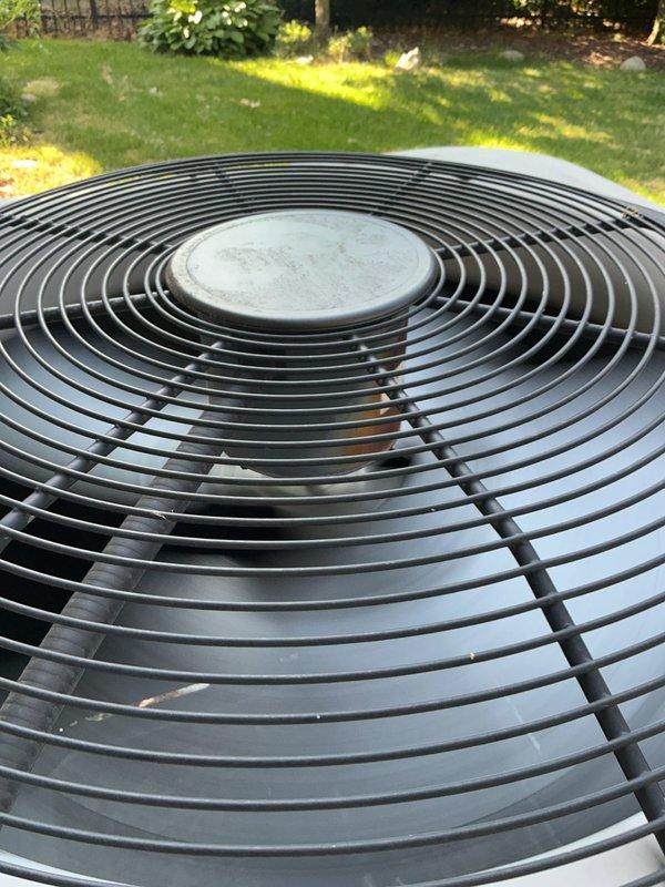 Performed comprehensive tune-up and inspection on a 10+ year old Goodman air conditioning unit (Model: 12GBNA042000BA88, Serial: 2110E31186) located in the basement with outdoor condenser. Inspected condenser unit fan assembly, verified proper operation of top-mounted fan grille and motor, checked manufacturer specifications including R410A refrigerant charge and electrical ratings at 208-230V AC. Evaluated overall system condition, confirmed unit functionality, and documented equipment specifications for maintenance records. System operating within normal parameters upon completion of inspection.