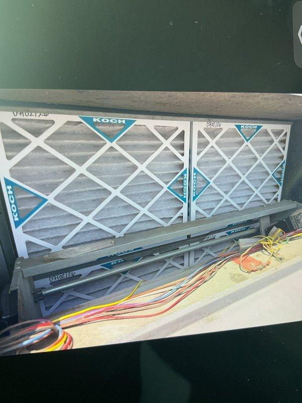 Performed scheduled filter maintenance on two rooftop units at commercial facility. Accessed roof-mounted RTUs and replaced existing air filters with Koch brand filters that were available on-site. All units returned to normal operation with improved airflow following filter replacement.