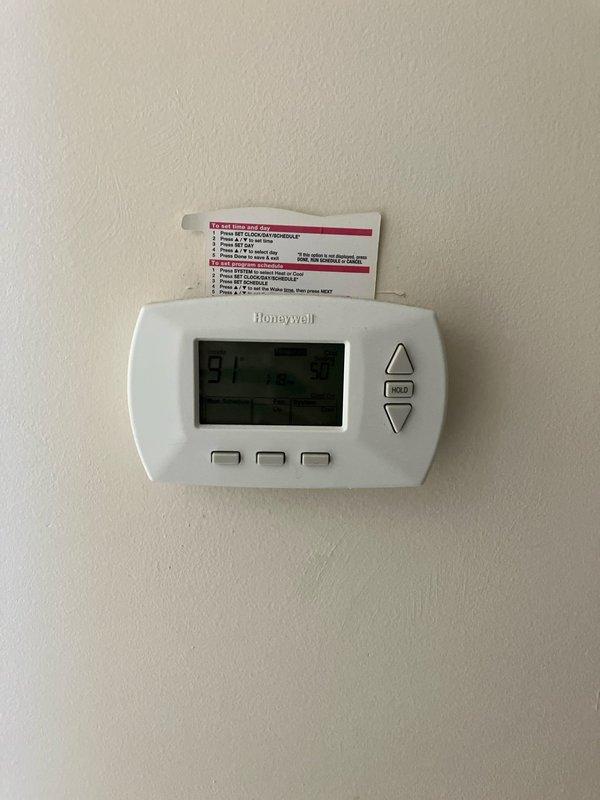 Completed new air conditioning system installation estimate for residence with no existing A/C unit. Assessed electrical infrastructure at exterior meter location on brick wall, including weatherproof meter enclosure, conduit routing, and secondary junction box with existing wiring connections. Evaluated interior thermostat location with Honeywell digital control currently managing emergency heat functions. Provided comprehensive estimate for complete outdoor condensing unit installation, including electrical requirements, proper placement considerations, and system specifications suitable for the property's configuration.