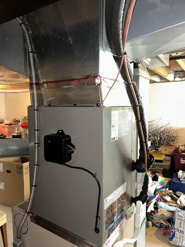 Successfully completed installation of a 3.5 ton air conditioning system with matching evaporator coil in residential basement location. Installed new air handler unit with proper refrigerant line connections on right side configuration, established condensate drainage via PVC piping, and completed electrical reconnection with appropriate disconnect and safety controls. All ductwork connections secured with proper sealing, system tested and verified operational, with mechanical, electrical, and air conditioning permits requested for code compliance.