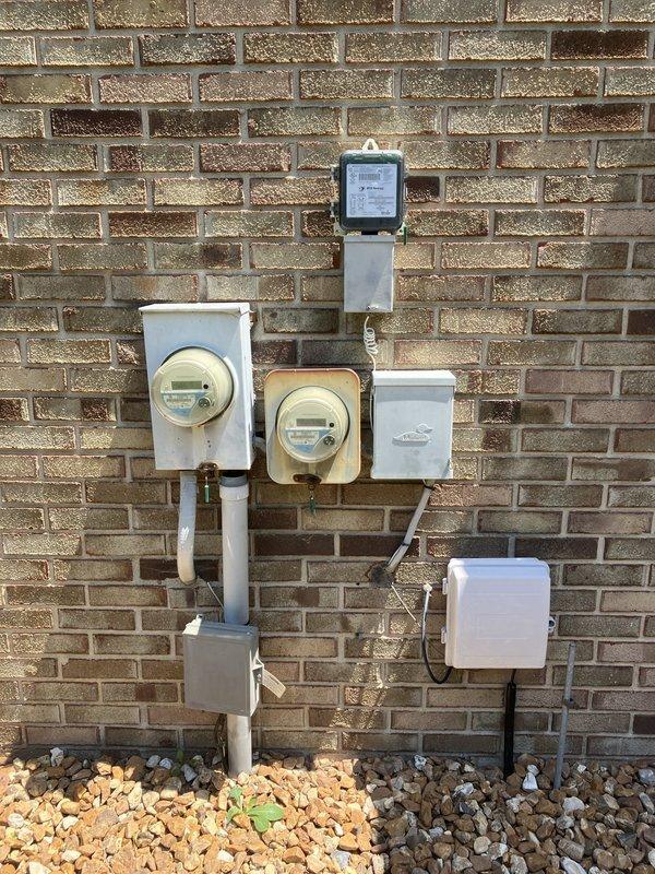Responded to service call for complete system failure affecting both heating and cooling control. Basement furnace (approximately 3 years old) and smart thermostat were non-operational, leaving entire residence without HVAC control. Performed diagnostic assessment and documented existing outdoor condensing unit and electrical metering configuration. Provided comprehensive replacement estimate for failed equipment to restore full system functionality.