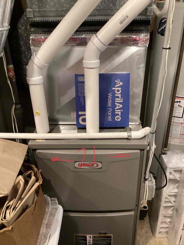Completed comprehensive HVAC system evaluation for 26-year-old R22 heating and cooling system located in basement. Identified low refrigerant charge in air conditioning unit and assessed overall condition of aging Lennox furnace with AprilAire humidifier component. Provided replacement estimate for complete system upgrade due to obsolete R22 refrigerant and equipment age exceeding typical service life.
