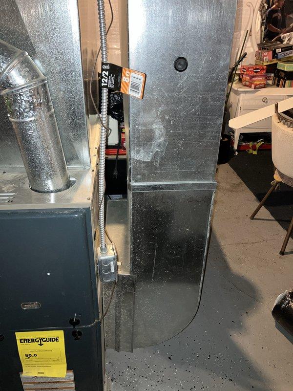 Conducted comprehensive on-site evaluation for air conditioning system replacement and indoor air quality assessment. Documented existing HVAC infrastructure including current furnace unit with vertical plenum assembly, supply ductwork configuration, and basement mechanical room layout. Photographed equipment specifications, including EnergyGuide ratings, to determine proper sizing and compatibility requirements for new AC installation and potential IAQ enhancements.
