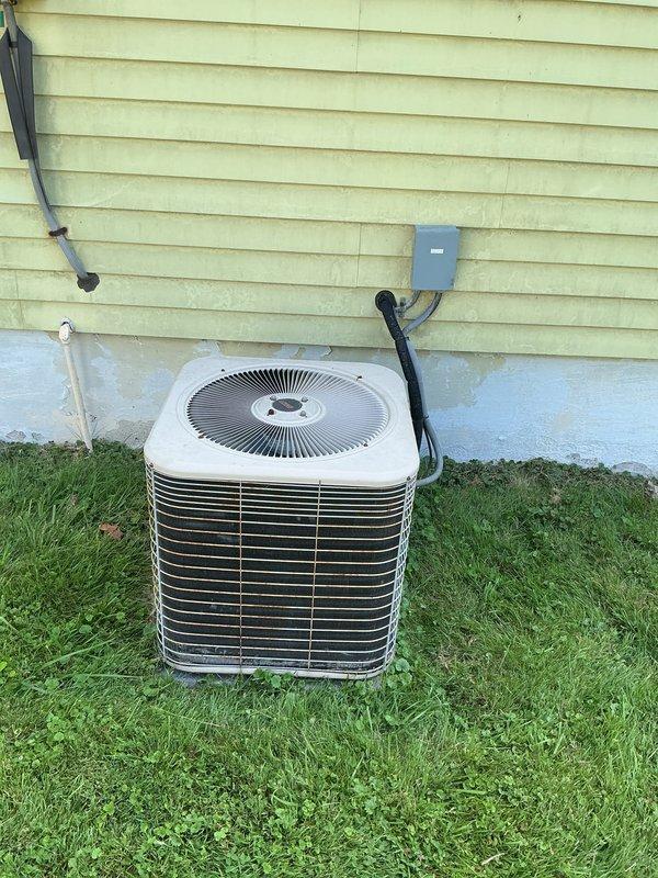 Responded to service call for central air conditioning system that was running but not producing cold air. Upon inspection, diagnosed locked compressor on outdoor condenser unit. Evaluated complete system including indoor air handler with condensate pump and determined compressor failure required full system replacement rather than repair. Provided comprehensive estimate for new HVAC system installation to restore cooling capability to residence.