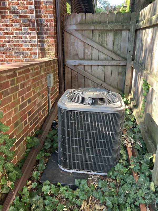 Responded to routine maintenance call for a 9-year-old residential air conditioning system located at rear of property. Upon inspection, discovered seized compressor in outdoor condenser unit, rendering the system inoperable and beyond economical repair. Provided comprehensive estimate for complete AC system replacement due to compressor failure, as repair costs would exceed value of aging equipment.
