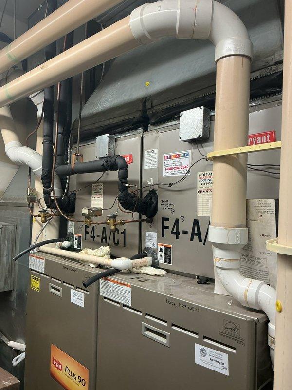 Completed installation of 2-ton air conditioning system with new evaporator coil in mechanical room. Installed two Bryant HVAC units (F4-A/C-1 and F4-A/C-2) with complete refrigerant line connections, condensate drainage system with pump, and electrical reconnections. All PVC piping, copper tubing, and insulation properly installed per code requirements. Mechanical, electrical, and AC permits obtained and work inspected. System tested and operational upon completion.