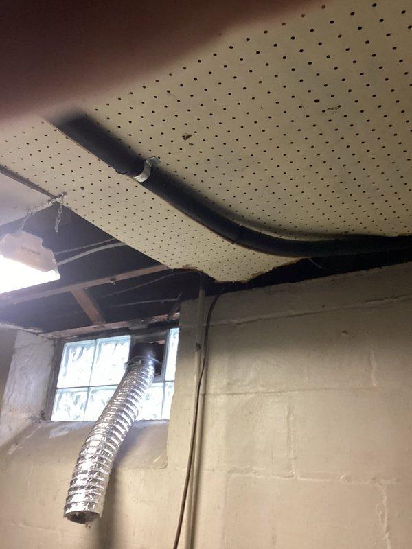 Responded to service call for central air conditioning system evaluation. Upon arrival, conducted comprehensive equipment assessment in basement utility area where HVAC system is located. Documented existing conditions including ceiling damage in mechanical space and current installation configuration of ductwork and equipment components. System confirmed operational for both heating and cooling functions at time of inspection. Provided estimate recommendations for equipment replacement options based on assessment findings.