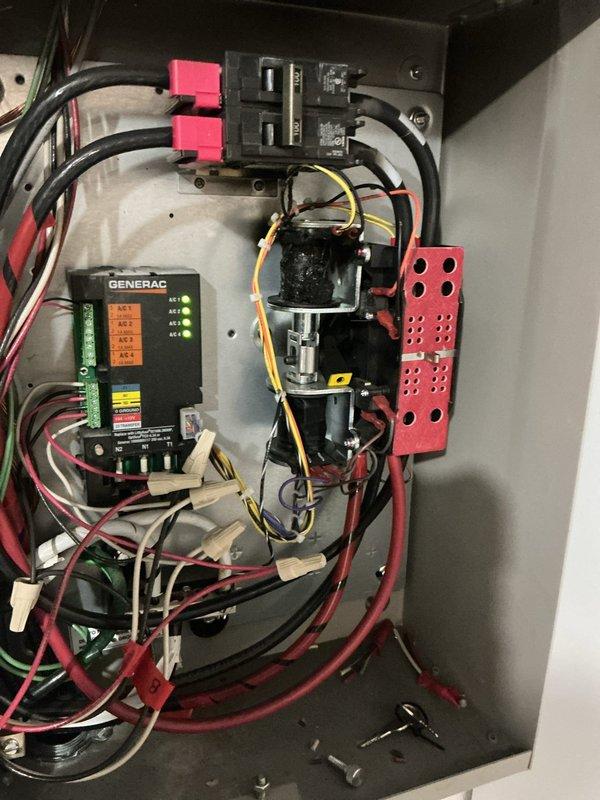 Responded to no-power condition affecting generator-supplied circuits following utility power restoration. Inspected Generac 24KW standby generator system including transfer switch, control module, and electrical distribution panel. Verified utility disconnect switch position, examined transfer switch operation and control board LED indicators, and confirmed proper wiring connections at bus bars and circuit breakers. System evaluated and operational status documented with photographic records of transfer switch interior components and external disconnect panel configuration.