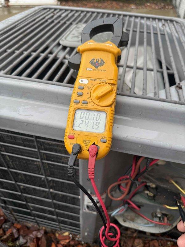 Completed Gold AC Inspection on 26-year-old air conditioning system with evaporator coil located in basement. Performed comprehensive evaluation including outdoor condensing unit levelness verification, electrical performance diagnostics using clamp meter to measure amperage draw and voltage readings, and visual inspection of all accessible components. Unit operational at time of inspection with electrical readings documented for baseline performance tracking.