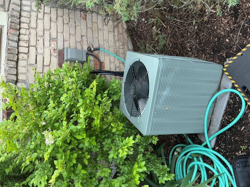 Completed comprehensive AC tune-up on 10-year-old residential split system with air handler in basement and outdoor condenser unit. Performed standard maintenance protocol including inspection of condenser coils, fan motor operation, refrigerant levels, electrical connections, and air handler components. System operating within normal parameters with no immediate issues identified; previous air leak concern from last year's service could not be reproduced during current inspection.