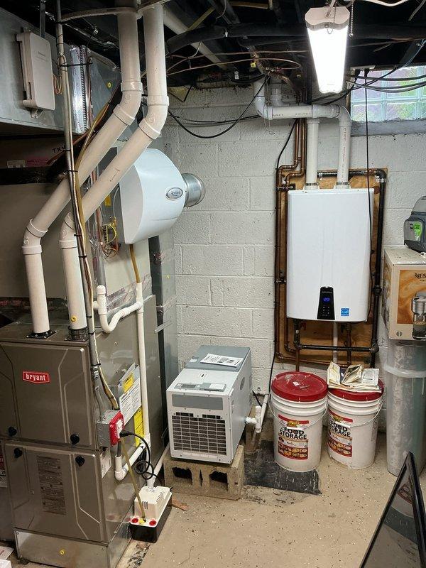 Completed comprehensive Gold AC Inspection on two exterior air conditioning units as part of routine preventive maintenance program. Performed multi-point inspection including refrigerant level verification, electrical connection testing, condenser coil cleaning, air filter evaluation, thermostat calibration, and operational performance assessment on both systems. Inspected indoor HVAC components including Bryant furnace, Aprilaire whole-home humidification system, and associated ductwork to ensure proper integration and airflow throughout the system. All equipment found operating within manufacturer specifications with no deficiencies noted; both AC units cycling properly with adequate cooling capacity and no refrigerant leaks detected.
