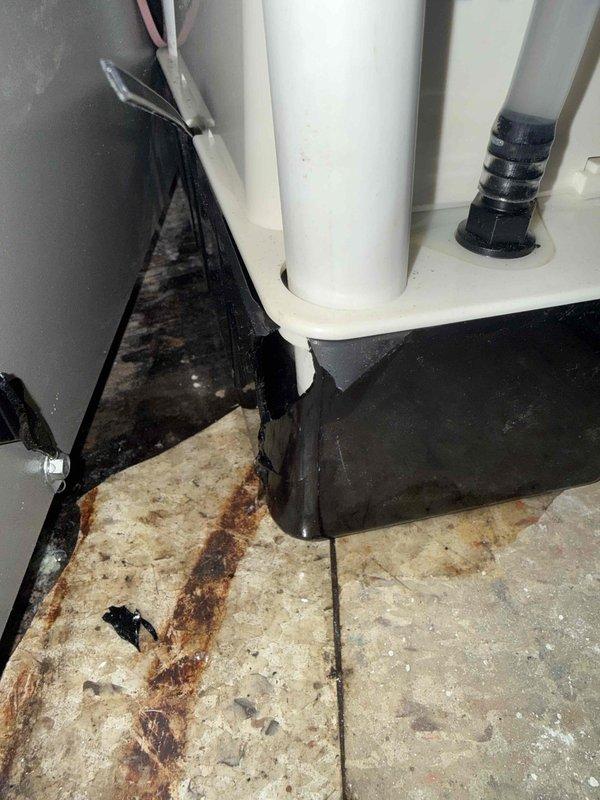 Responded to service call for water leakage on newly installed air conditioning system located in basement. Upon inspection, identified improperly pitched condensate drain line causing water to back up and overflow onto floor, resulting in visible staining on tile surface. Corrected PVC drain line pitch to ensure proper gravity drainage, verified condensate pump operation and float switch functionality, and tested system through complete cooling cycle. Confirmed all condensate properly draining with no further leakage detected.