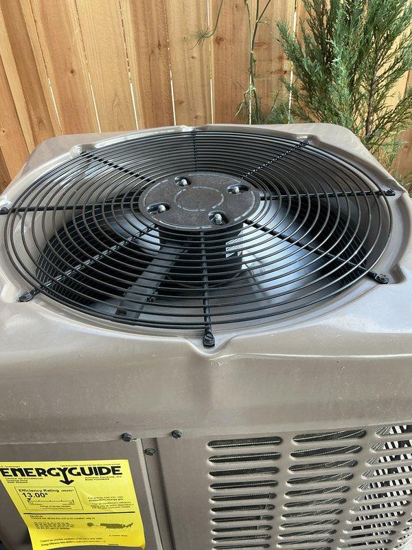 Completed comprehensive Gold AC Inspection on 2-year-old residential cooling system. Performed full tune-up on outdoor condenser unit, inspecting fan motor assembly, electrical connections, and refrigerant levels. Verified proper airflow through coil fins and checked compressor operation. Inspected indoor furnace blower motor and electrical wiring harnesses, confirming all connections secure and components operating within specifications. Cleaned condenser coils, checked voltage and amperage readings at both units, and tested thermostat communication. All systems found operating efficiently with no deficiencies noted. Unit showing normal wear consistent with age, with all safety controls functioning properly. Documented equipment condition with photos of both indoor furnace cabinet and outdoor condenser unit for maintenance records.